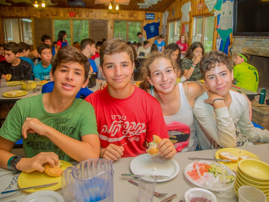 Campers in dining hall eating dinner