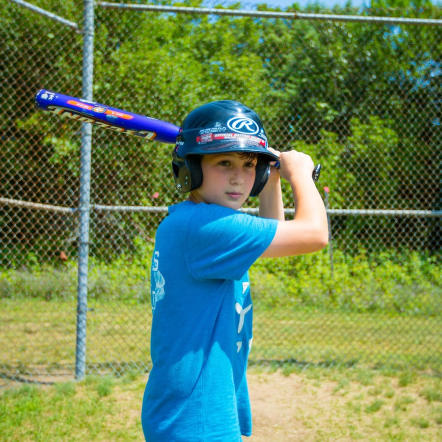 Camper swinging baseball bat