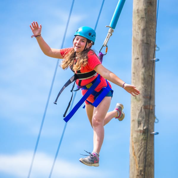 Girl on high ropes course